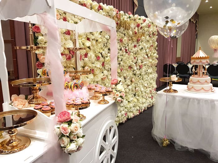 Candy cart and flower wall