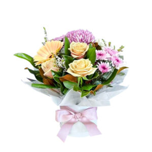 A traditional arrangement of roses, carnations, chrysanthemums accompanied with a selection of lush foliage.