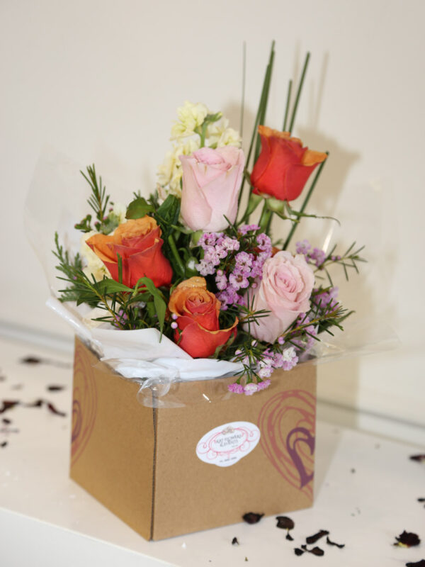 Roses with stock in a cardboard box